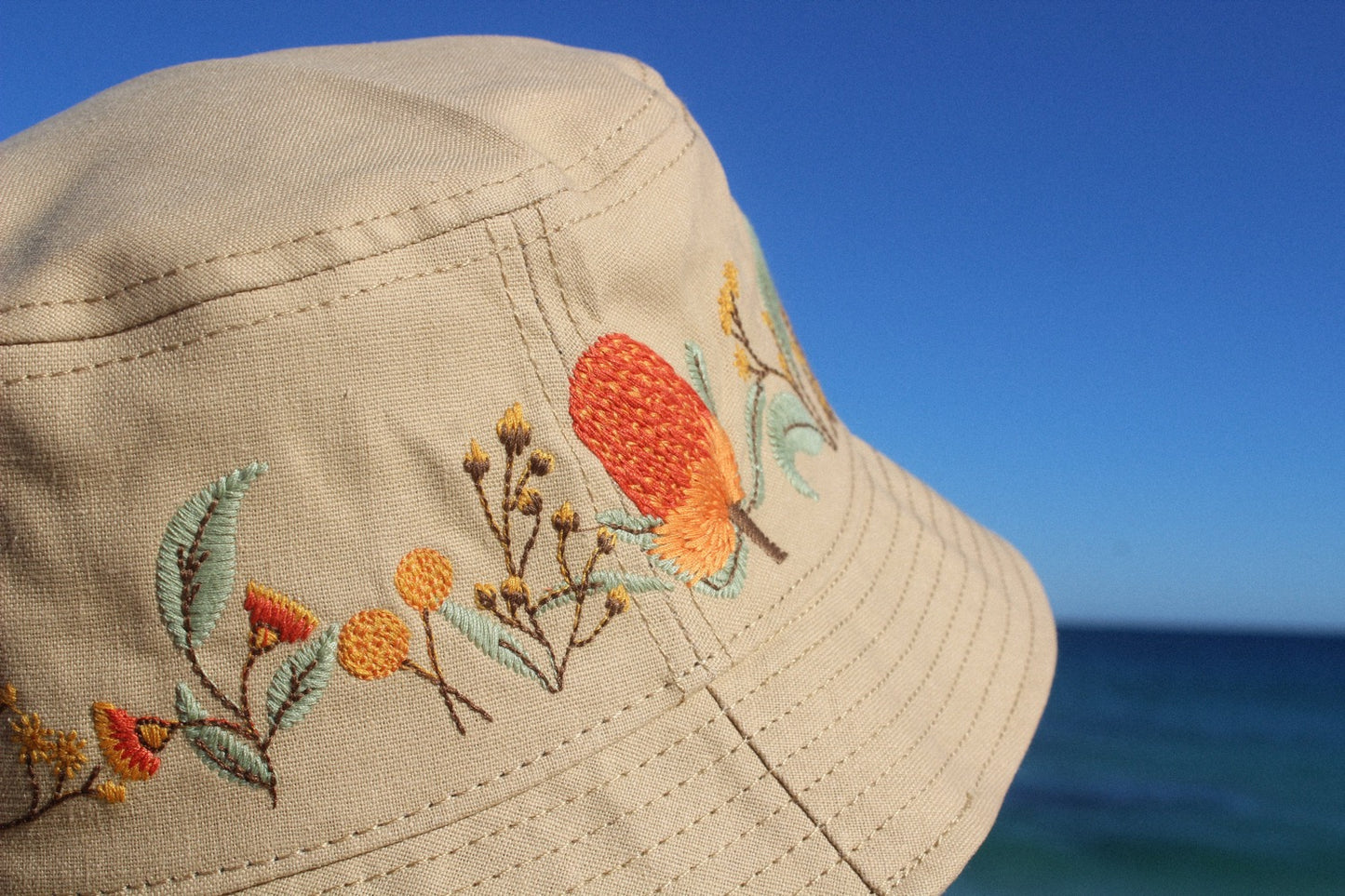 Closeup of Australian natives bucket hat's embroidery